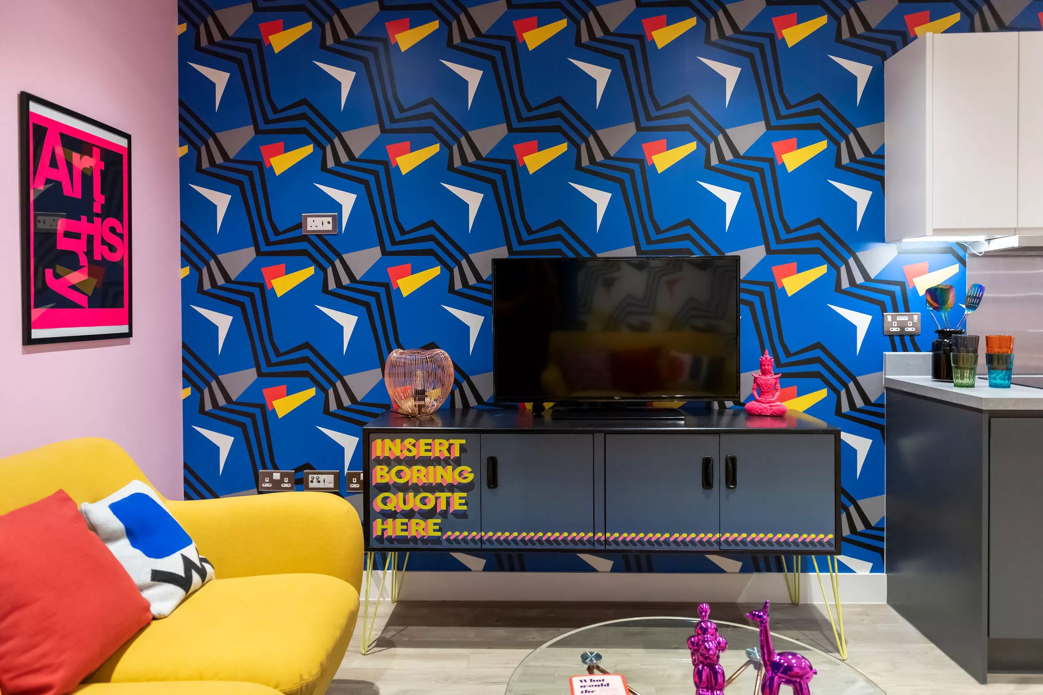 A bright, patterned accent wall is a quick way to inject summer vibes into your home