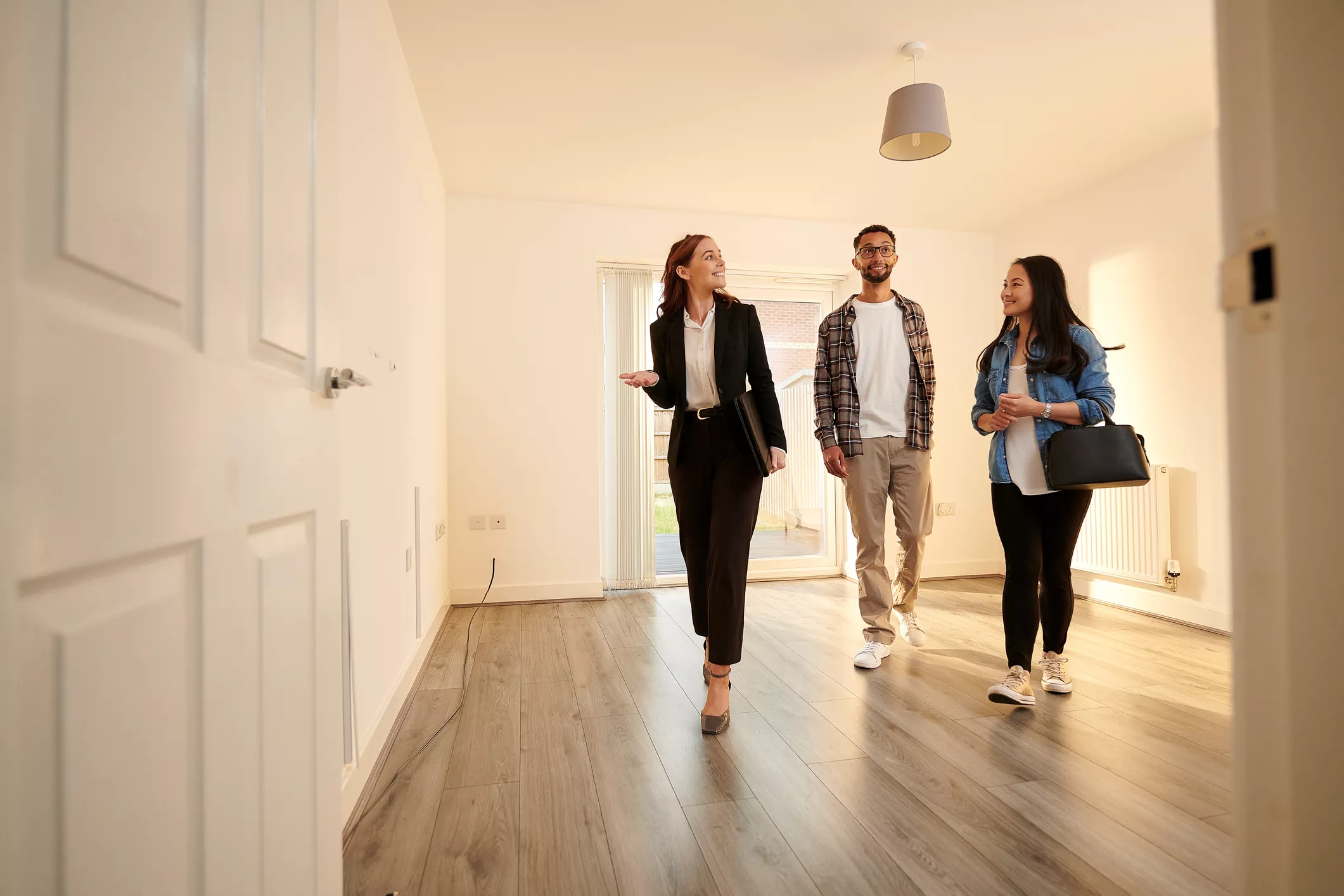 couple viewing a house with an estate agent