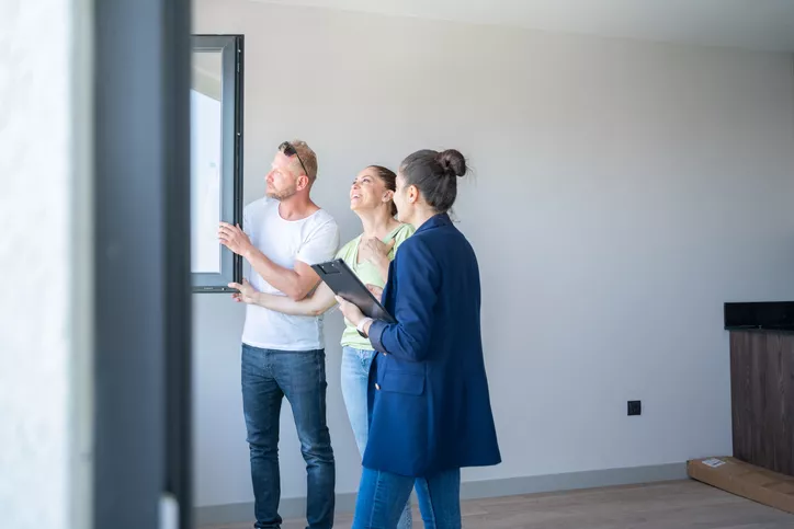 Couple viewing a new build home