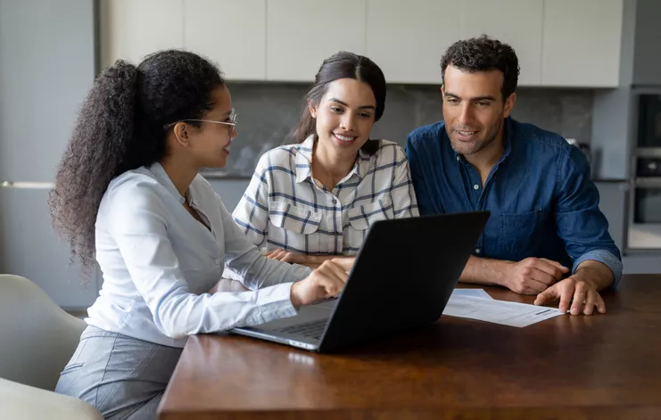 Couple speaking to a financial advisor